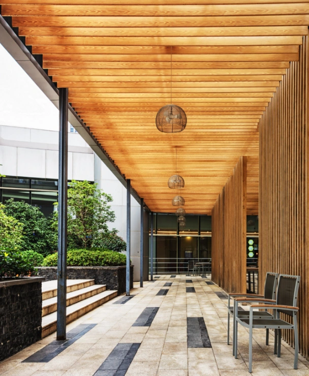 Contemporary patio walkway with wood ceiling installation in Los Angeles by Patio Chic LA
